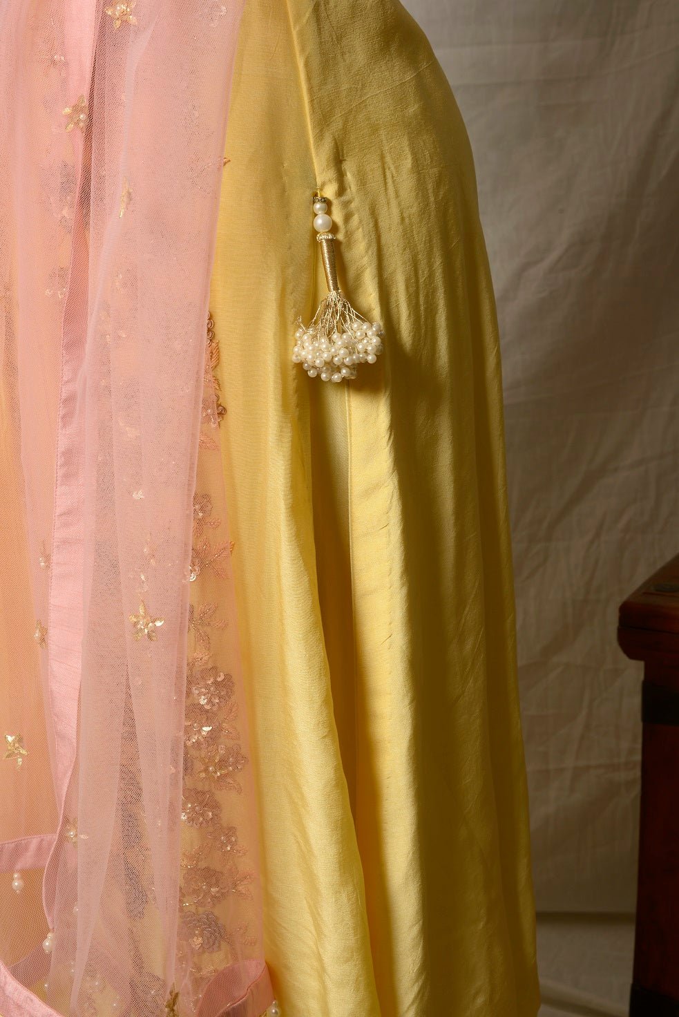 Shop stunning lemon yellow embroidered Uppada silk suit online in USA with pink dupatta. Shine at weddings and special occasions with beautiful Indian designer suits, gowns, lehengas from Pure Elegance Indian clothing store in USA.-closeup