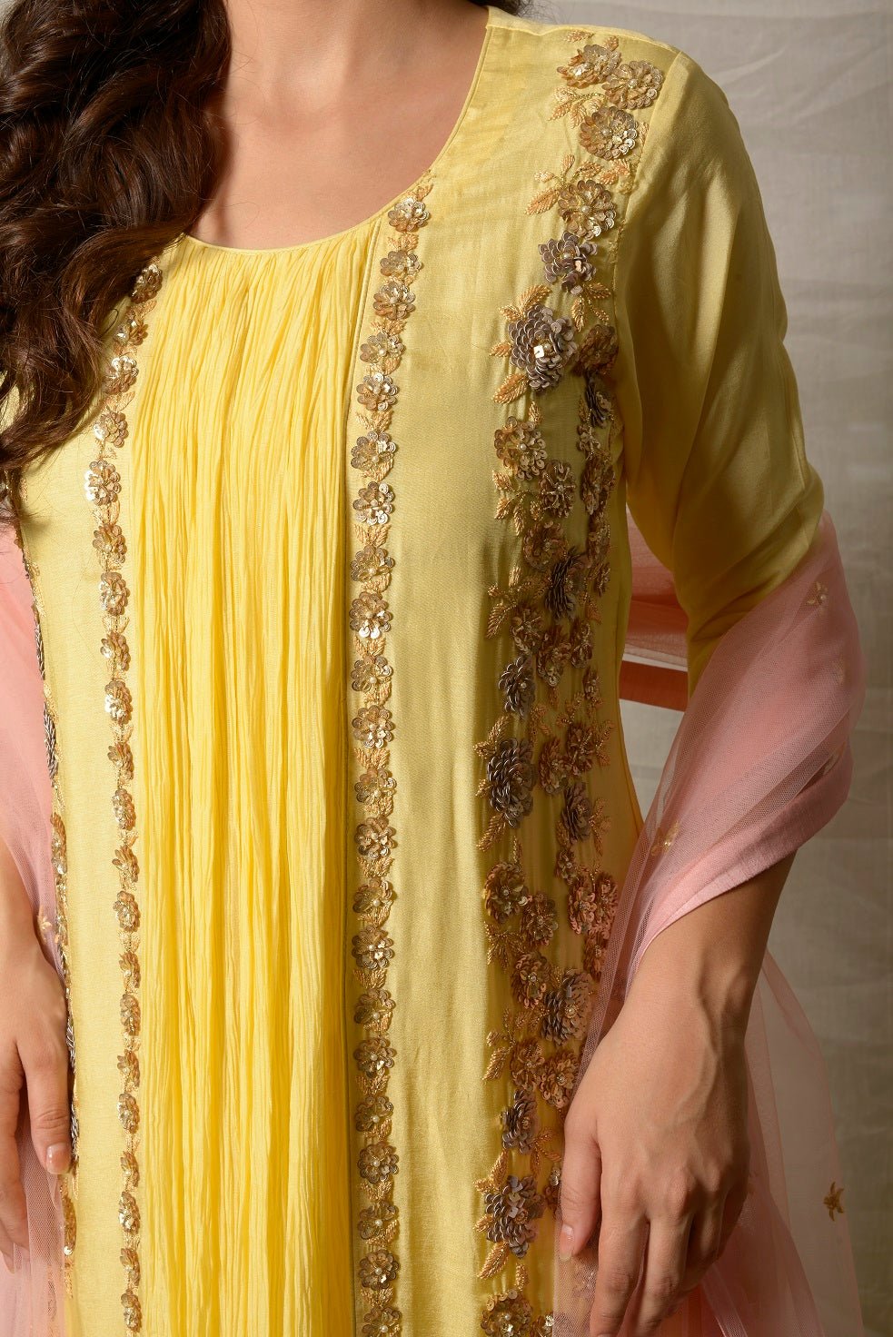 Shop stunning lemon yellow embroidered Uppada silk suit online in USA with pink dupatta. Shine at weddings and special occasions with beautiful Indian designer suits, gowns, lehengas from Pure Elegance Indian clothing store in USA.-embroidery