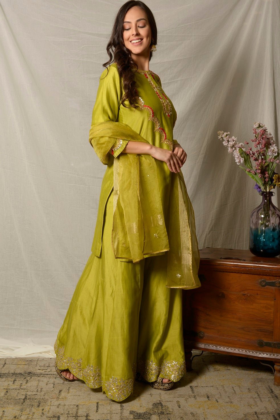 Shop beautiful pista green embroidered chanderi sharara suit online in USA with dupatta. Shine at weddings and special occasions with beautiful Indian designer suits, gowns, lehengas from Pure Elegance Indian clothing store in USA.-right side
