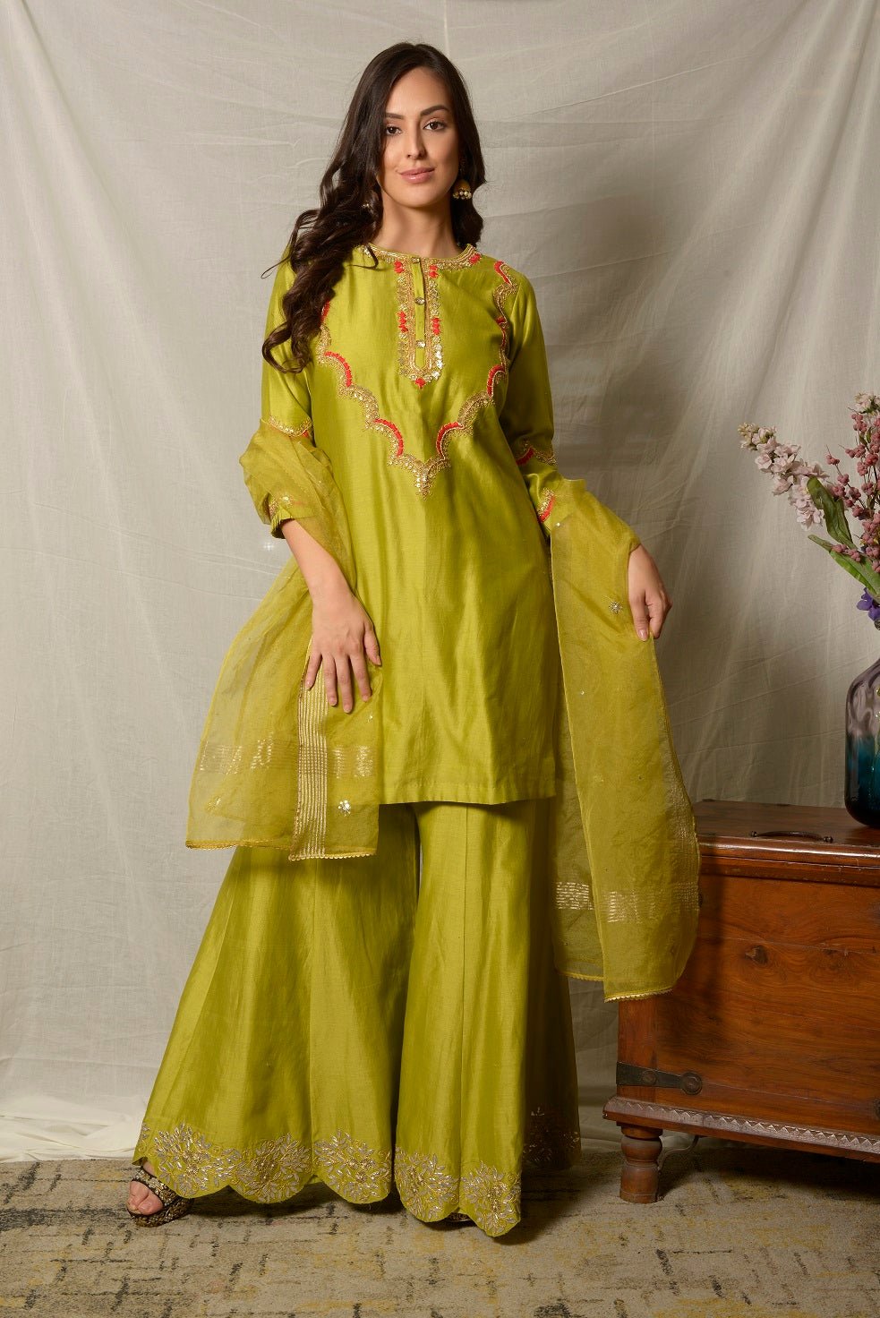 Shop beautiful pista green embroidered chanderi sharara suit online in USA with dupatta. Shine at weddings and special occasions with beautiful Indian designer suits, gowns, lehengas from Pure Elegance Indian clothing store in USA.-front