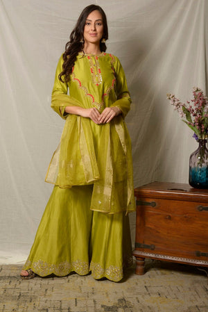 Shop beautiful pista green embroidered chanderi sharara suit online in USA with dupatta. Shine at weddings and special occasions with beautiful Indian designer suits, gowns, lehengas from Pure Elegance Indian clothing store in USA.-suit
