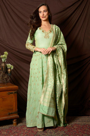 Buy gorgeous sea green embroidered tissue chanderi Anarkali suit online in USA with Banarasi dupatta. Shine at weddings and special occasions with beautiful Indian Anarkali suits, gowns, lehengas from Pure Elegance Indian clothing store in USA.-front