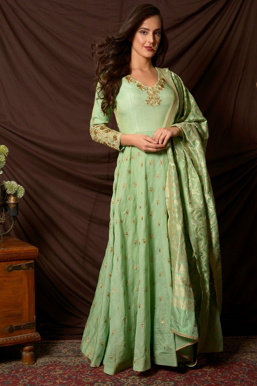Buy gorgeous sea green embroidered tissue chanderi Anarkali suit online in USA with Banarasi dupatta. Shine at weddings and special occasions with beautiful Indian Anarkali suits, gowns, lehengas from Pure Elegance Indian clothing store in USA.-suit