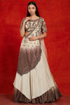 Shop beautiful beige and brown lehenga online in USA with antique silver embroidery.  Make a fashion statement on festive occasions and weddings with designer suits, Indian dresses, Anarkali suits, palazzo suits, designer gowns, sharara suits from Pure Elegance Indian fashion store in USA.-full view