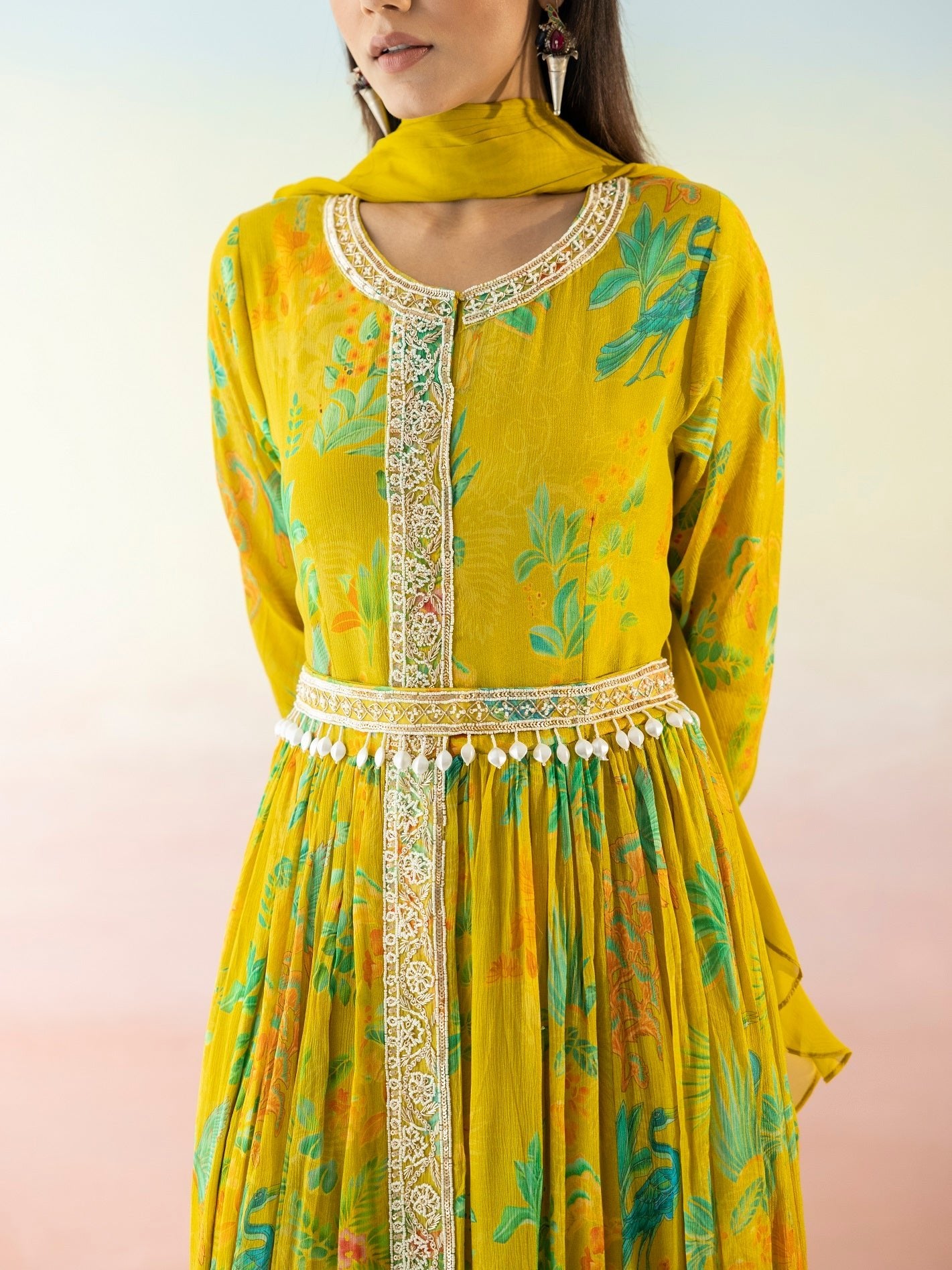 Shop yellow printed georgette Anarkali online in USA with dupatta. Make a fashion statement on festive occasions and weddings with designer suits, Indian dresses, Anarkali suits, palazzo suits, designer gowns, sharara suits from Pure Elegance Indian fashion store in USA.-closeup