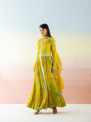 Shop yellow printed georgette Anarkali online in USA with dupatta. Make a fashion statement on festive occasions and weddings with designer suits, Indian dresses, Anarkali suits, palazzo suits, designer gowns, sharara suits from Pure Elegance Indian fashion store in USA.-left