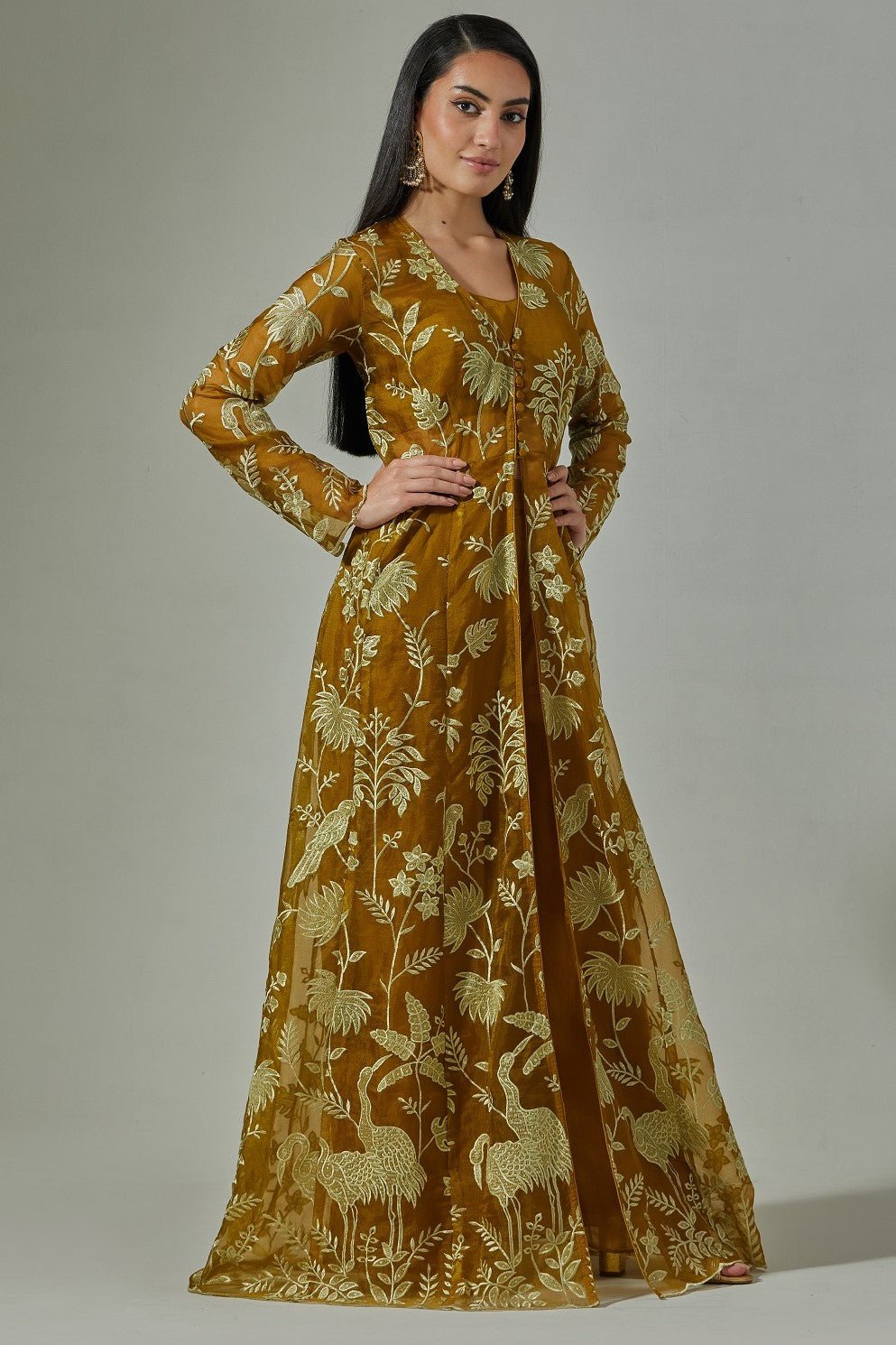 Buy beautiful rust gold thread embroidered cape and pant set online in USA. Dazzle on weddings and special occasions with exquisite Indian designer dresses, sharara suits, Anarkali suits, wedding lehengas from Pure Elegance Indian fashion store in USA.-side