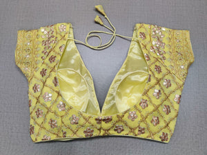 Buy this yellow color beautiful sequin designer blouse from Pure Elegance. A perfect go-to combination for your contemporary yet ethnic look. Elevate your Indian saree style with exquisite readymade sari blouse, embroidered saree blouses, Banarasi sari blouse, and designer sari blouse from Pure Elegance Indian clothing store in USA.- Back View
