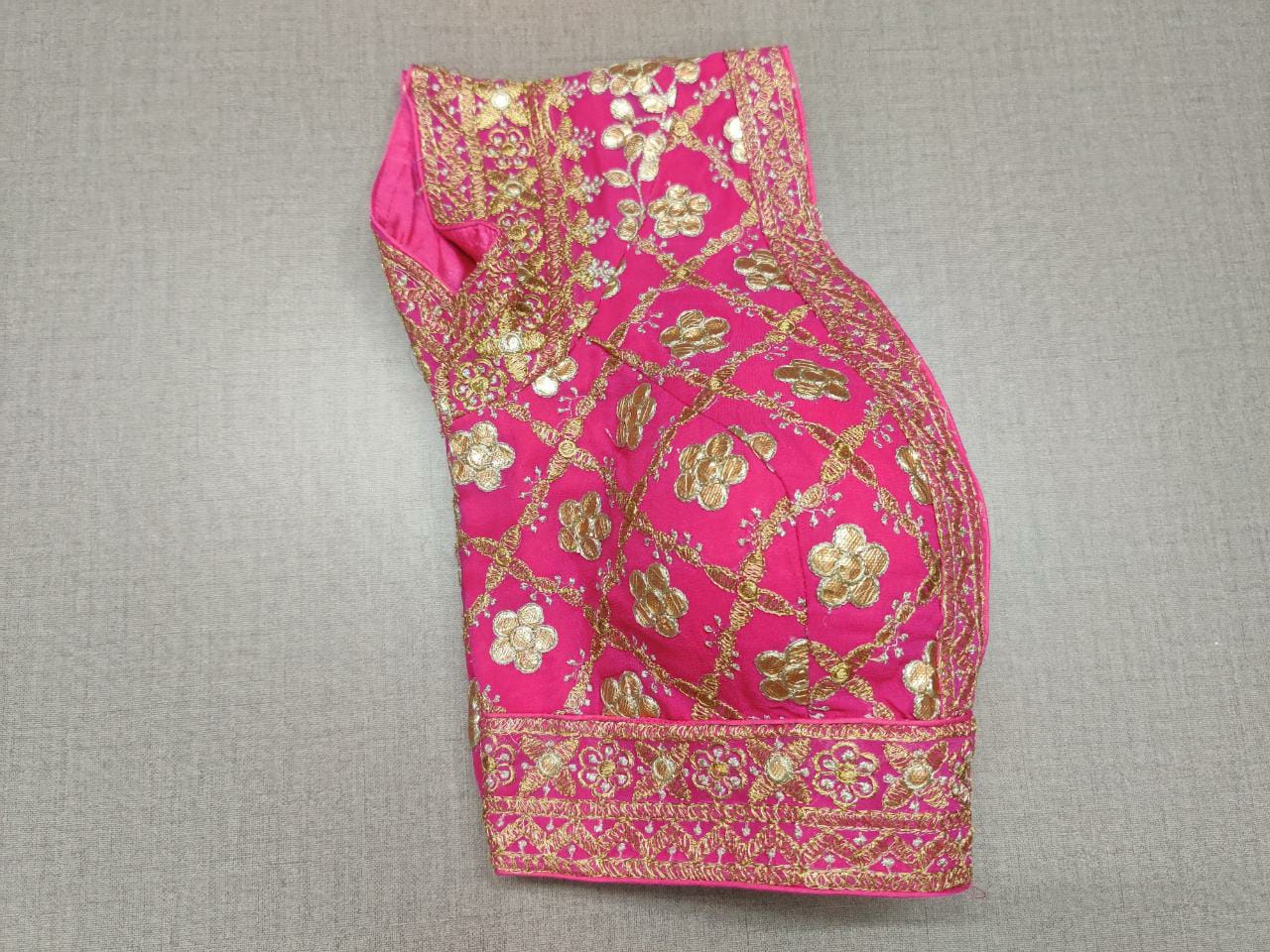 Liven up the festivities with this pink colored blouse. Tailored in silk, featuring beautiful embroidery work. Give your festive outfit a dazzling update with this lively pink blouse. Featuring all-over mirror embroidery, this blouse is the perfect match for your solid separates. Buy this designer blouse in the USA from Pure Elegance. - Folded View