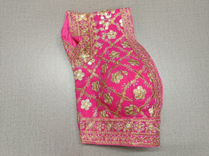 Liven up the festivities with this pink colored blouse. Tailored in silk, featuring beautiful embroidery work. Give your festive outfit a dazzling update with this lively pink blouse. Featuring all-over mirror embroidery, this blouse is the perfect match for your solid separates. Buy this designer blouse in the USA from Pure Elegance. - Folded View