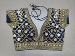 Liven up the festivities with this navy blue colored blouse. Tailored in silk, featuring beautiful embroidery work. Give your festive outfit a dazzling update with this lively navy blue crop top. Featuring all-over mirror embroidery, this top is the perfect match for your solid separates. Buy this designer blouse in the USA from Pure Elegance. - Front View