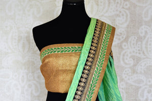 Buy green silk and black net embroidered half and half saree online in USA from Pure Elegance. Let your ethnic style be one of a kind with an exquisite variety of Indian handloom sarees, pure silk sarees, designer sarees from our exclusive fashion store in USA.-blouse pallu
