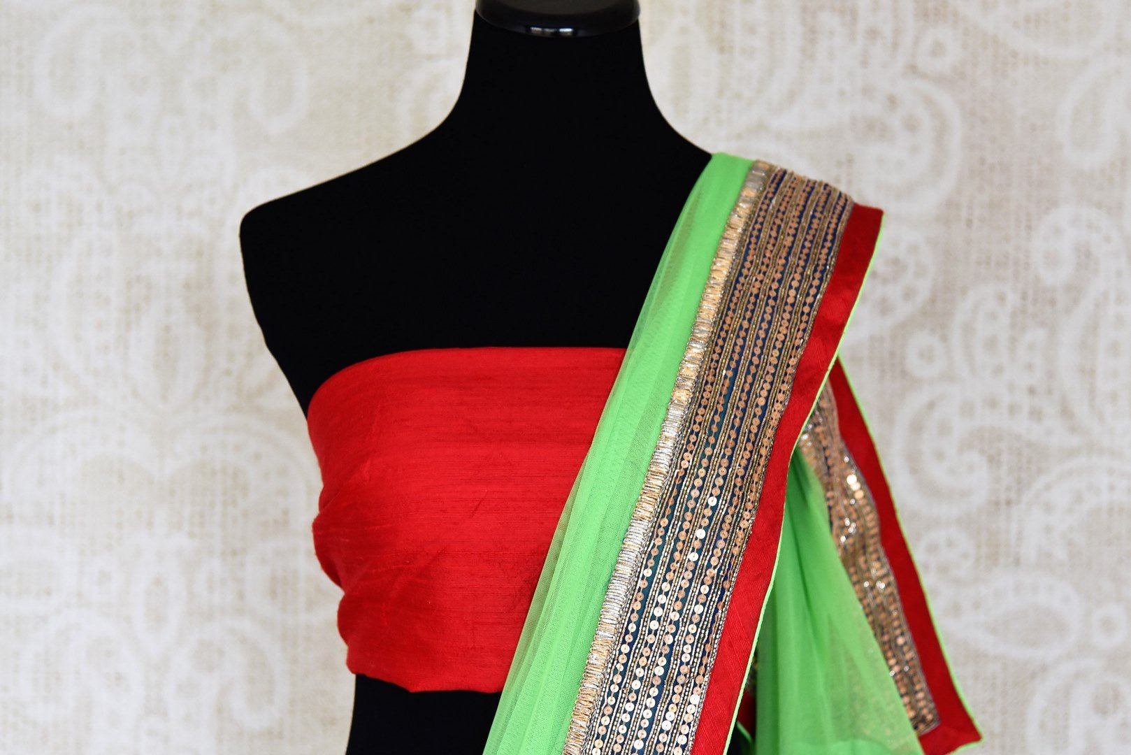 Shop parrot green net saree online in USA with embroidered border from Pure Elegance. Let your ethnic style be one of a kind with an exquisite variety of Indian handloom sarees, pure silk sarees, Bollywood sarees from our exclusive fashion store in USA.-blouse pallu
