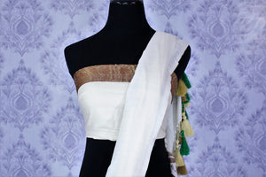 Buy classic white muga Banarasi sari online in USA. Select from an exquisite collection of traditional Indian Banarasi sarees, silk sarees at Pure Elegance clothing store or shop online for weddings, parties, and festivals.-blouse pallu