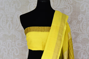 Shop bright yellow muga Banarasi saree online in USA with floral buta from Pure Elegance online store. Visit our exclusive Indian clothing store in USA and get floored by a range of exquisite Indian Kanjivaram saris, Banarasi sarees, silk sarees, Indian jewelry and much more to complete your ethnic look.-blouse pallu