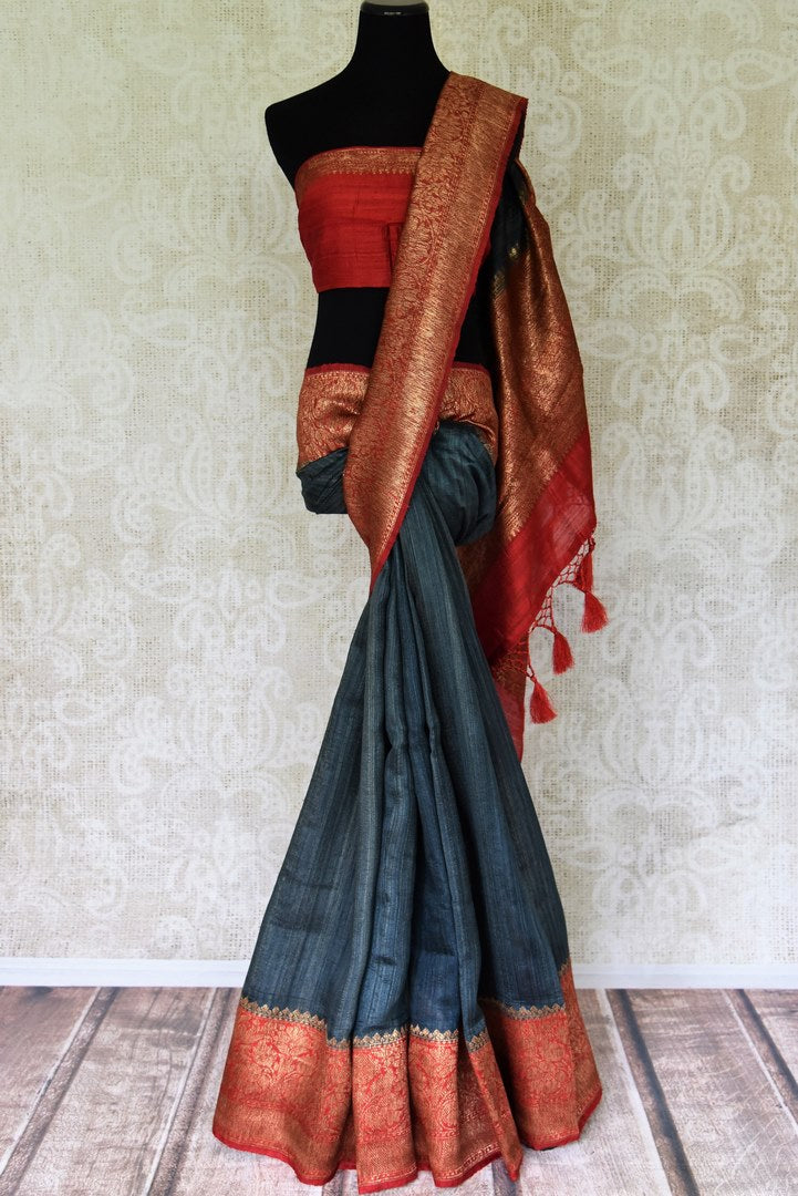 Buy elegant charcoal grey tussar Banarasi saree online in USA with red zari border and pallu. Redefine your ethnic sartorial choice with a splendid variety of handwoven silk sarees, Banarasi sarees from Pure Elegance Indian clothing store in USA.-full view