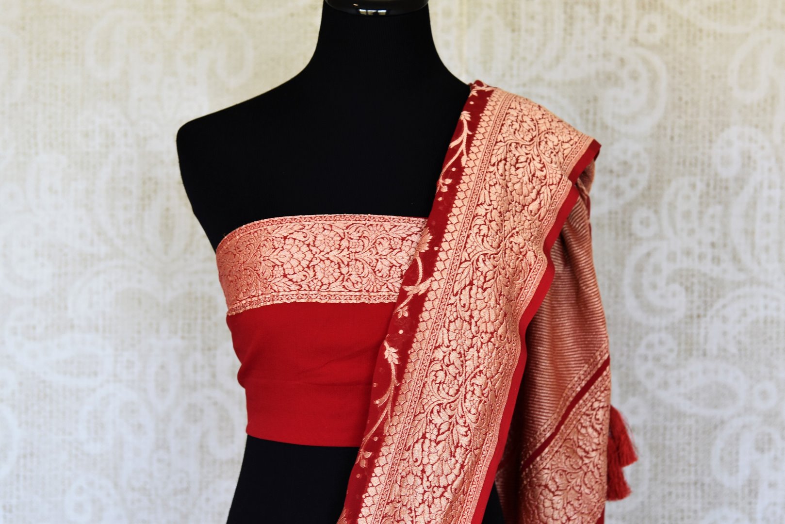 Buy traditional red georgette Banarasi sari online in USA with zari work. Feel traditional on special occasions in beautiful Indian designer saris from Pure Elegance Indian fashion store in USA. Choose from a splendid variety of Banarasi sarees, pure handwoven saris. Buy online.-blouse pallu