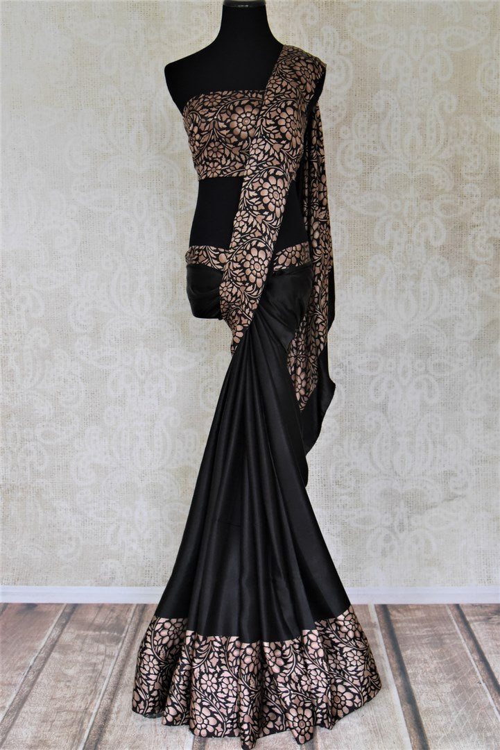 Shop classic black crepe silk saree online in USA with floral print border. Shop stunning printed sarees, georgette sarees, floral sarees in USA from Pure Elegance Indian cloth boutique in USA. Visit our store now.-full view