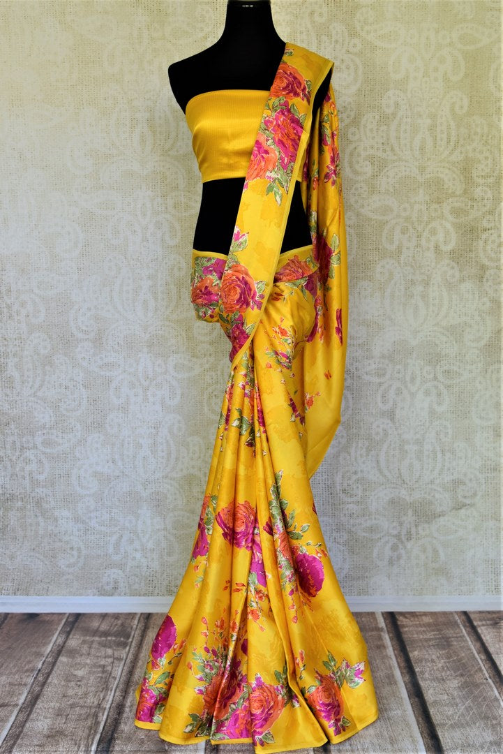 Shop beautiful yellow crepe silk saree online in USA with pink floral print. Be the center of attraction at parties and weddings with exquisite designer sarees, print sarees, Bollywood sarees from Pure Elegance Indian fashion store in USA.-full view