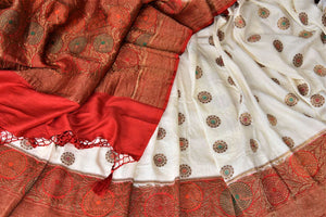Buy off-white muga Banarasi sari online in USA with red antique zari floral border. Keep your ethnic style updated with latest designer sarees, handloom sarees, pure silk sarees from Pure Elegance Indian fashion store in USA.-details