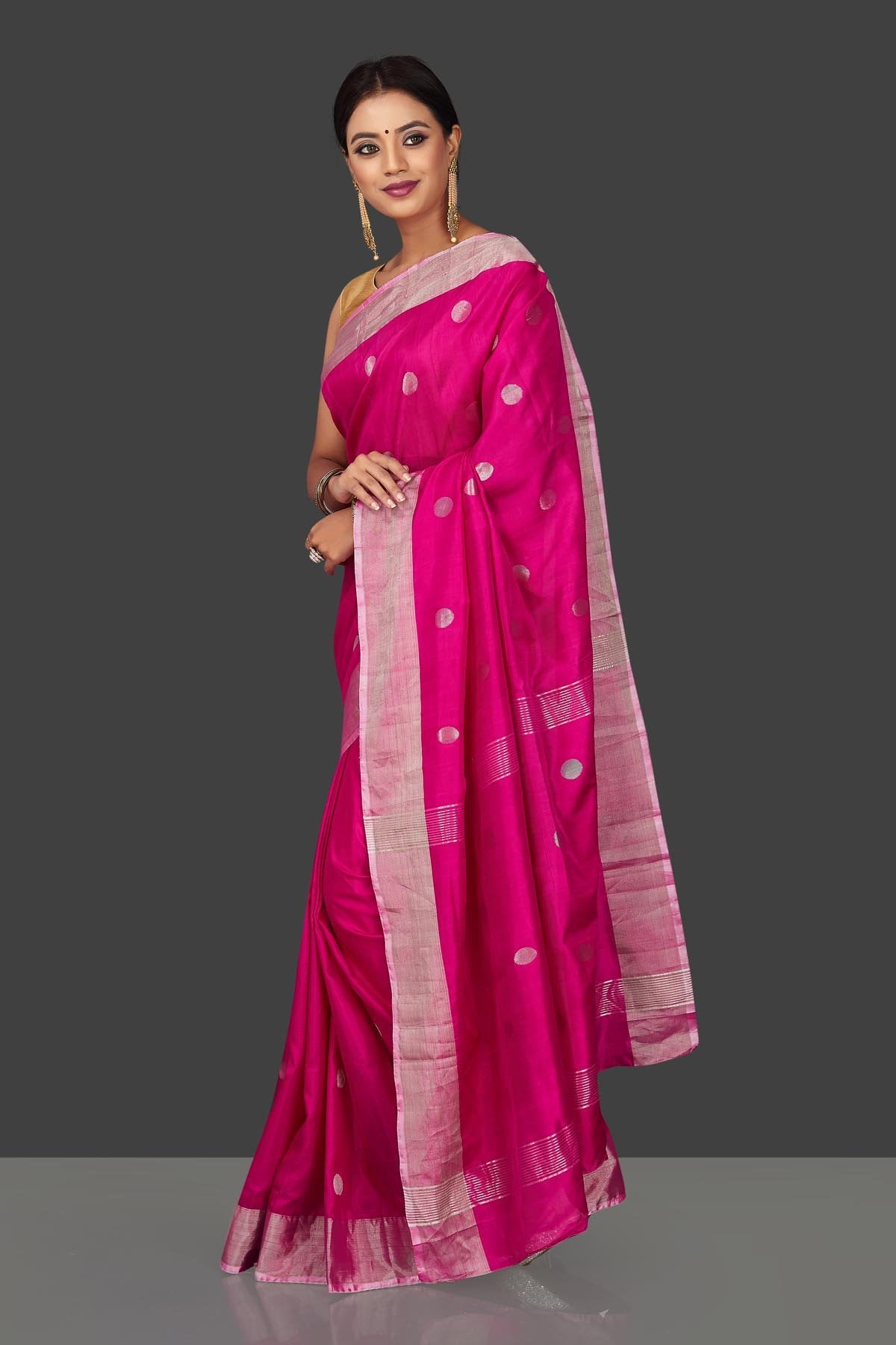 Buy bright pink Uppada silk saree online in USA with silver zari buta and border. Keep it elegant with handwoven silk sarees, Uppada silk sarees, soft silk sarees from Pure Elegance Indian fashion boutique in USA. We bring a especially curated collection of ethnic sarees for Indian women in USA under one roof!-left side