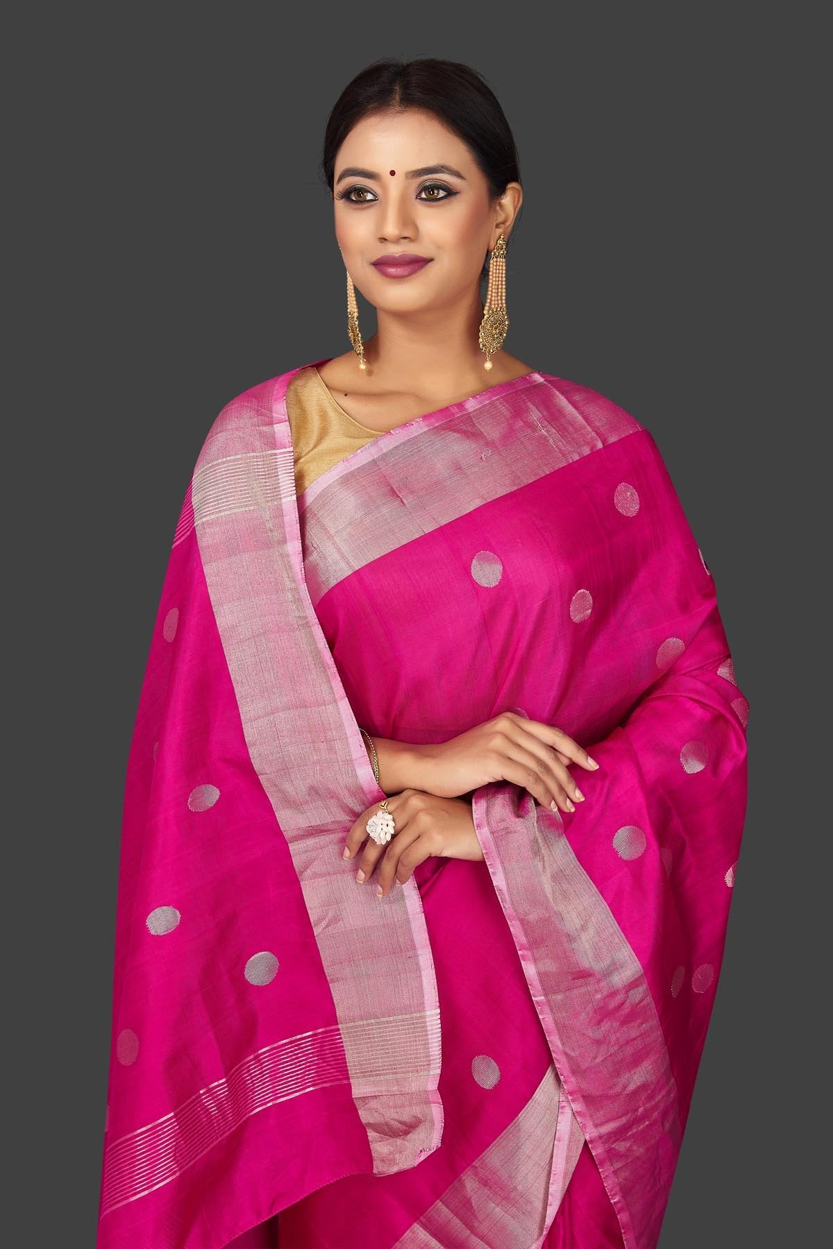 Buy bright pink Uppada silk saree online in USA with silver zari buta and border. Keep it elegant with handwoven silk sarees, Uppada silk sarees, soft silk sarees from Pure Elegance Indian fashion boutique in USA. We bring a especially curated collection of ethnic sarees for Indian women in USA under one roof!-closeup