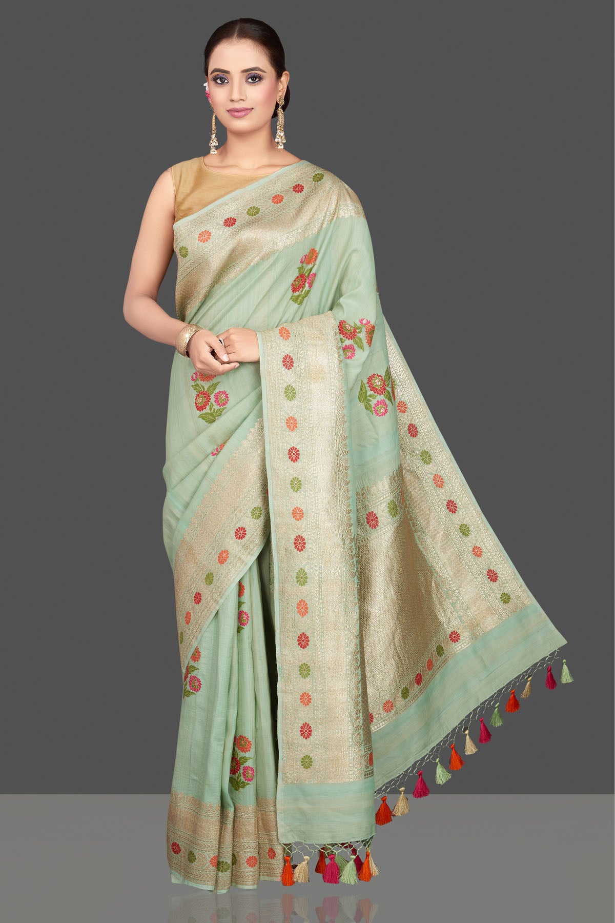 Shop beautiful mint green tussar georgette saree online in USA with floral weave buta and silver zari border. Look gorgeous on special occasions with exquisite Indian sarees, handwoven sarees, Banarasi sarees, pure silk sarees from Pure Elegance Indian saree store in USA.-front