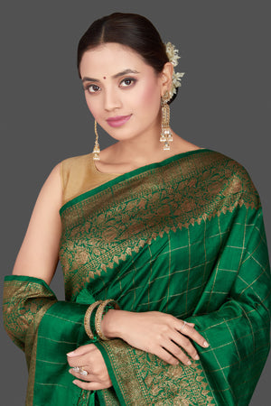 Shop stunning green check tussar Banarasi saree online in USA with antique zari border. Go for stunning Indian designer sarees, georgette sarees, handwoven saris, embroidered sarees for festive occasions and weddings from Pure Elegance Indian clothing store in USA.-closeup