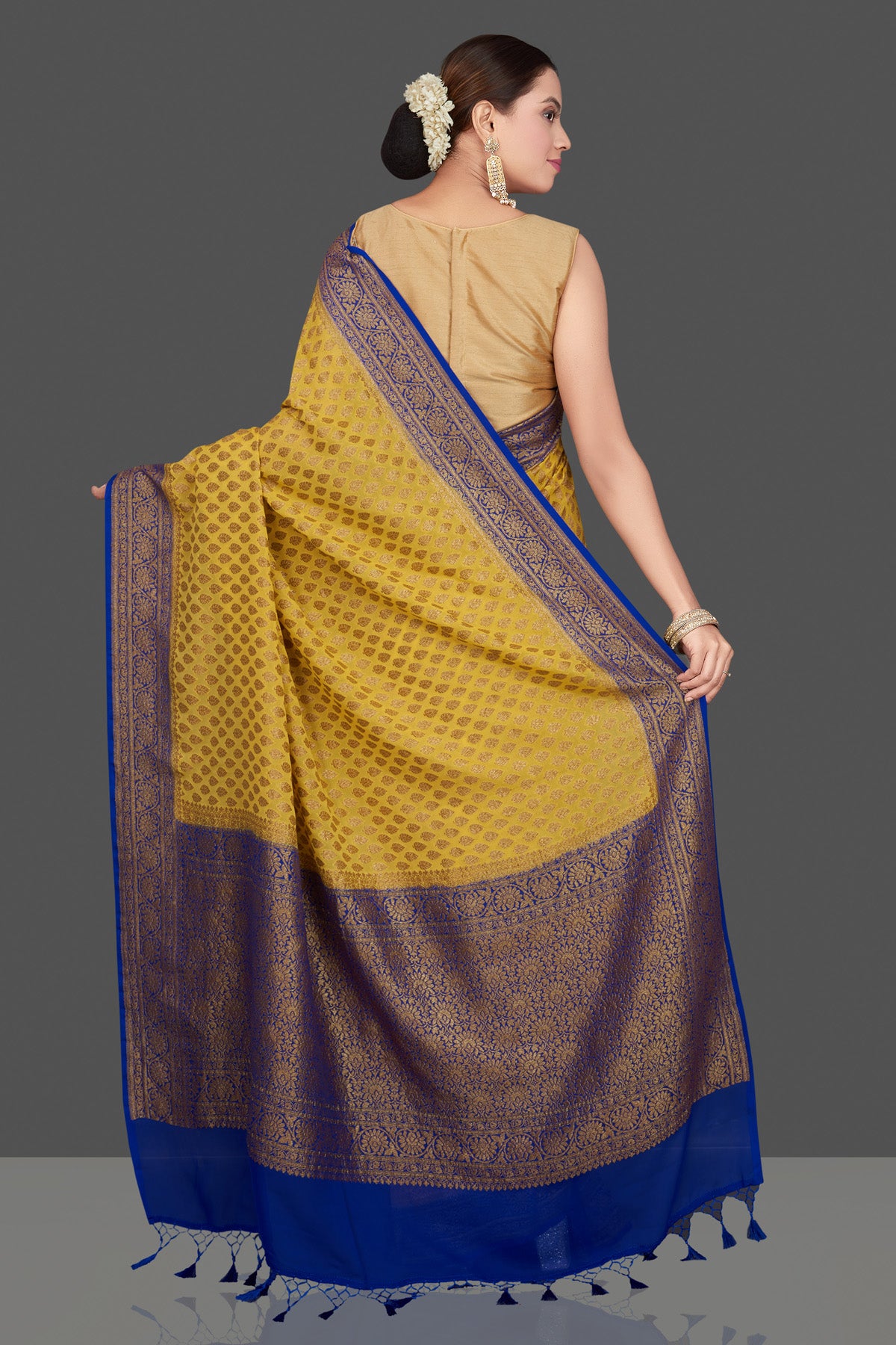 Buy stunning yellow georgette Banarasi saree online in USA with blue zari border. Get ready for festive occasions and weddings in tasteful designer sarees, Banarasi sarees, handwoven sarees from Pure Elegance Indian clothing store in USA.-back