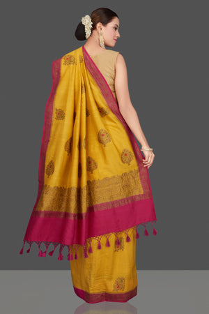 Shop stunning yellow Muga Banarasi saree online in USA with pink antique zari border. Get ready for festive occasions and weddings in tasteful designer sarees, Banarasi sarees, handwoven sarees from Pure Elegance Indian clothing store in USA.-back