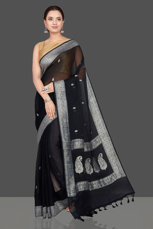 Buy black chiffon georgette saree online in USA with silver zari border. Go for stunning Indian designer sarees, georgette sarees, handwoven saris, embroidered sarees for festive occasions and weddings from Pure Elegance Indian clothing store in USA.-front