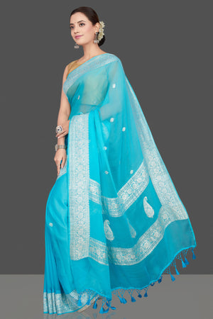 Buy beautiful sky blue chiffon georgette sari online in USA with silver zari border. Go for stunning Indian designer sarees, georgette sarees, handwoven saris, embroidered sarees for festive occasions and weddings from Pure Elegance Indian clothing store in USA.-pallu