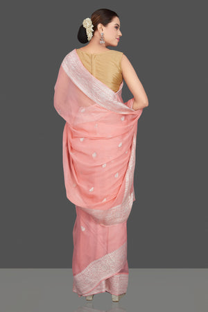 Shop stunning blush pink georgette chiffon sari online in USA with silver zari border. Go for stunning Indian designer sarees, georgette sarees, handwoven saris, embroidered sarees for festive occasions and weddings from Pure Elegance Indian clothing store in USA.-back
