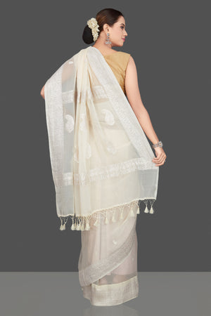 Shop cream georgette chiffon sari online in USA with silver zari border. Go for stunning Indian designer sarees, georgette sarees, handwoven sarees, embroidered sarees for festive occasions and weddings from Pure Elegance Indian clothing store in USA.-back