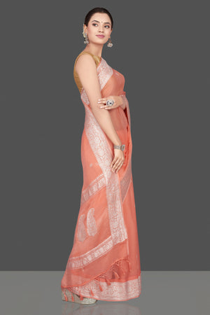 Buy stunning peach color georgette chiffon saree online in USA with silver zari border. Go for stunning Indian designer sarees, georgette sarees, handwoven sarees, embroidered sarees for festive occasions and weddings from Pure Elegance Indian clothing store in USA.-side