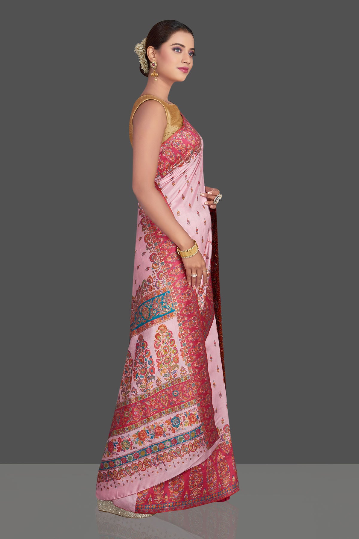 Shop stunning light pink Kani embroidery tussar silk saree online in USA. Make your presence felt on special occasions in beautiful embroidered sarees, handwoven sarees, pure silk saris, tussar sarees from Pure Elegance Indian saree store in USA.-side