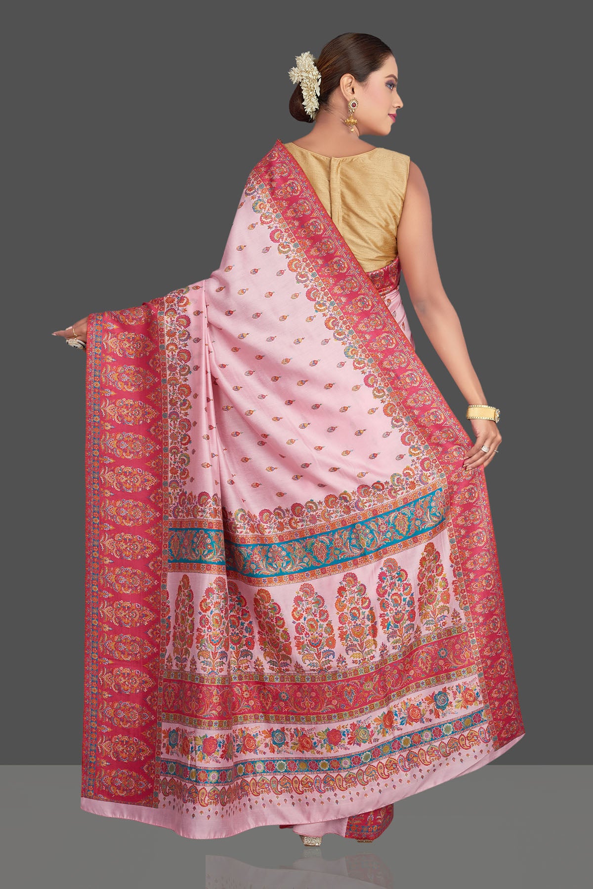 Shop stunning light pink Kani embroidery tussar silk saree online in USA. Make your presence felt on special occasions in beautiful embroidered sarees, handwoven sarees, pure silk saris, tussar sarees from Pure Elegance Indian saree store in USA.-back