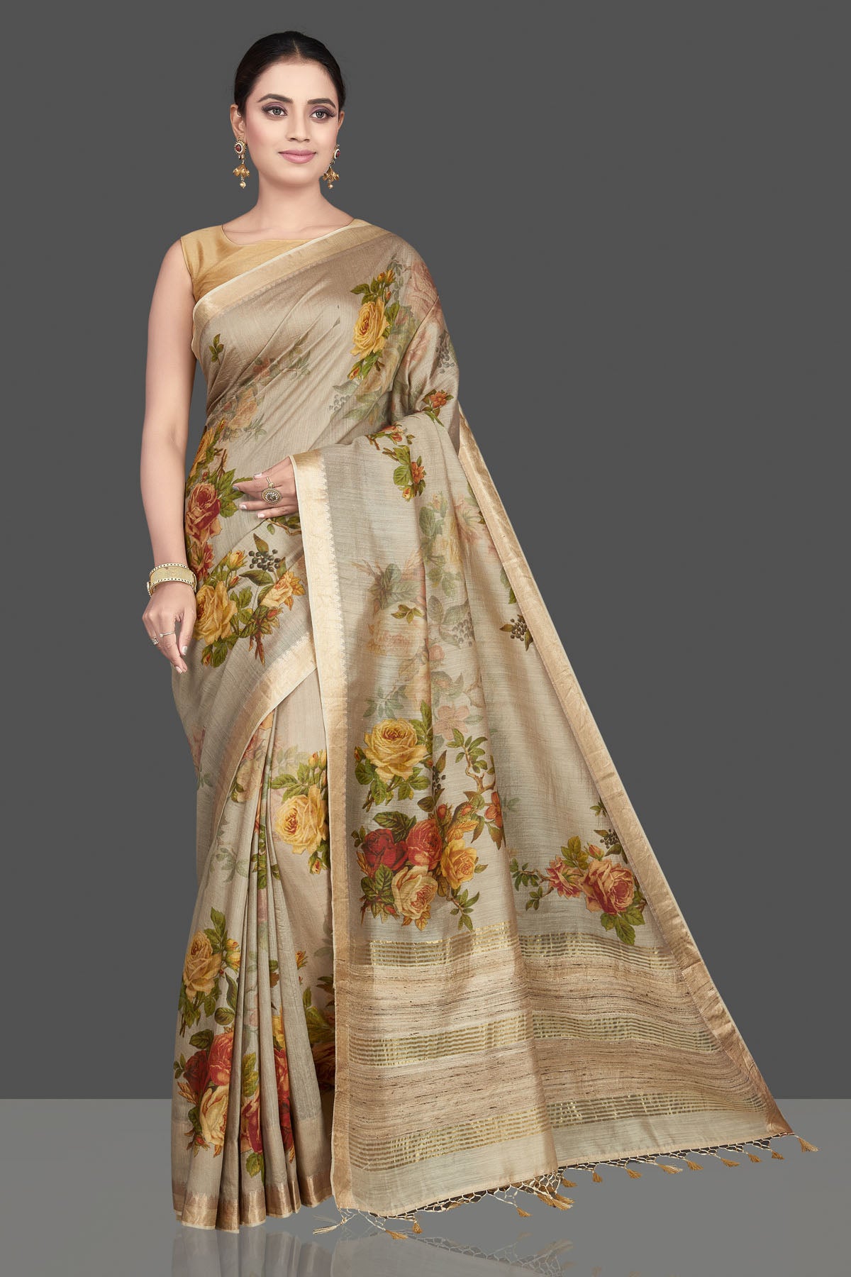 Shop gorgeous beige floral print Muga silk sari online in USA with golden border. Look attractive on weddings and parties in beautiful designer sarees, pure silk sarees, handwoven saris, embroidered sarees, zari work sarees from Pure Elegance Indian saree store in USA. -front
