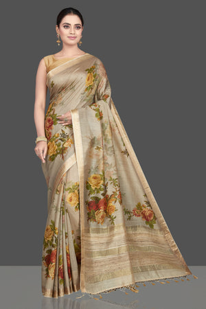 Shop gorgeous beige floral print Muga silk sari online in USA with golden border. Look attractive on weddings and parties in beautiful designer sarees, pure silk sarees, handwoven saris, embroidered sarees, zari work sarees from Pure Elegance Indian saree store in USA. -front