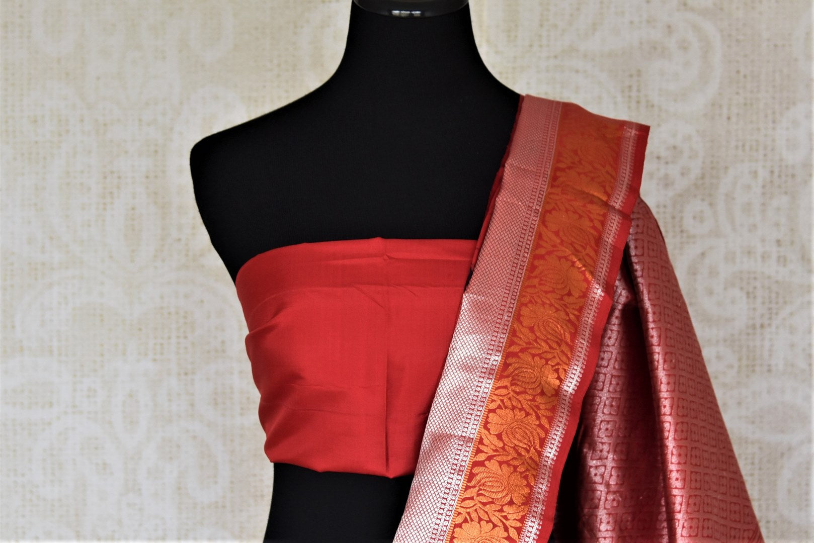 Buy gorgeous red floral print Gadhwal silk saree online in USA with golden zari border and zari pallu. Look attractive on special occasions in the beautiful silk sarees, designer saris, embroidered sarees, handwoven saris from Pure Elegance Indian fashion store in USA.-blouse pallu