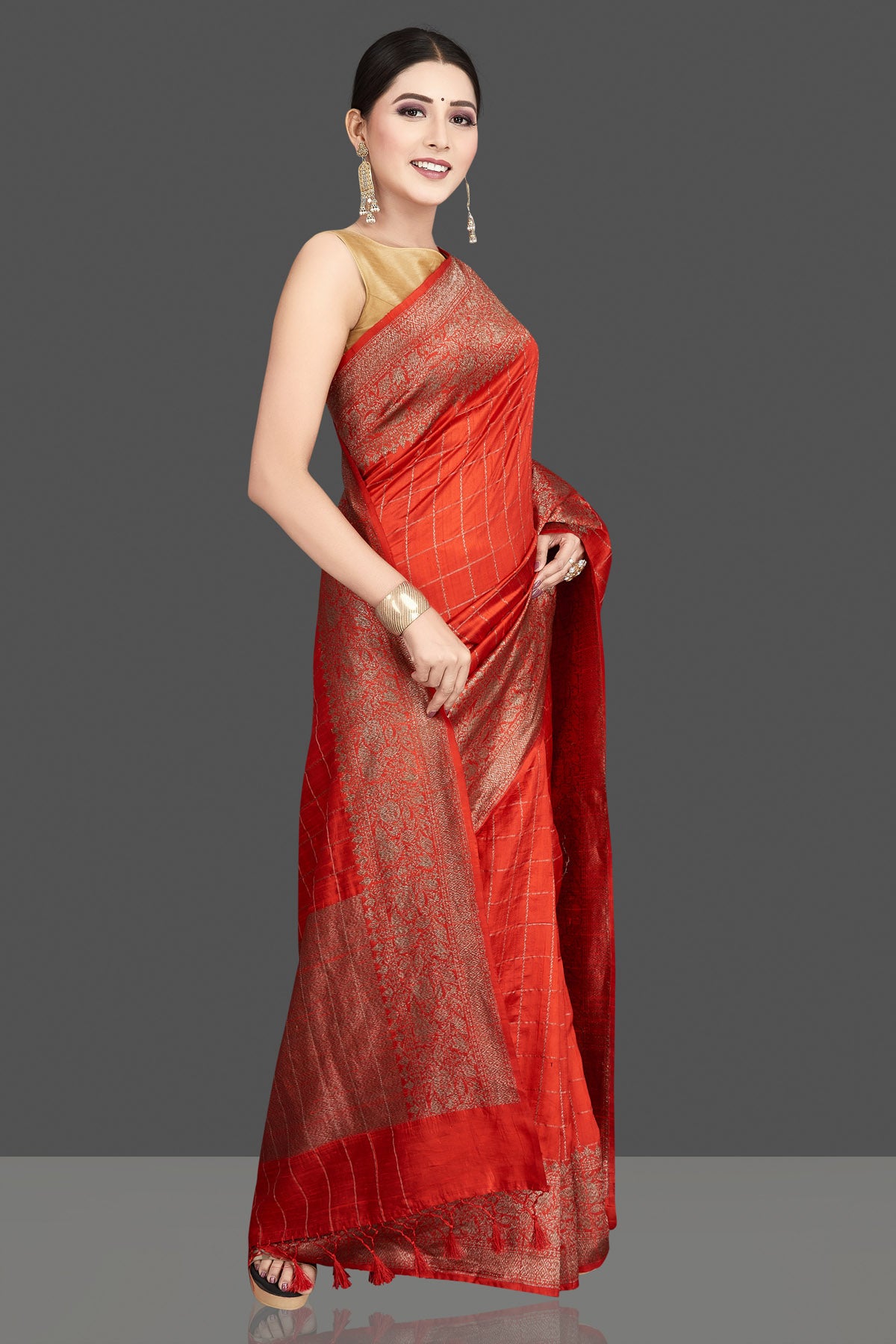 Shop stunning red tussar silk saree online in USA with golden zari border. Be the center of attraction at weddings and special occasions in exquisite designer sarees, handwoven silk saris, embroidered sarees, pure silk sarees from Pure Elegance Indian fashion store in USA.-side
