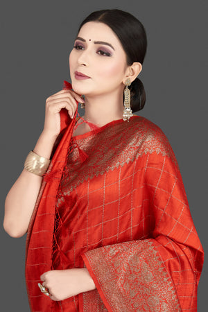 Shop stunning red tussar silk saree online in USA with golden zari border. Be the center of attraction at weddings and special occasions in exquisite designer sarees, handwoven silk saris, embroidered sarees, pure silk sarees from Pure Elegance Indian fashion store in USA.-closeup