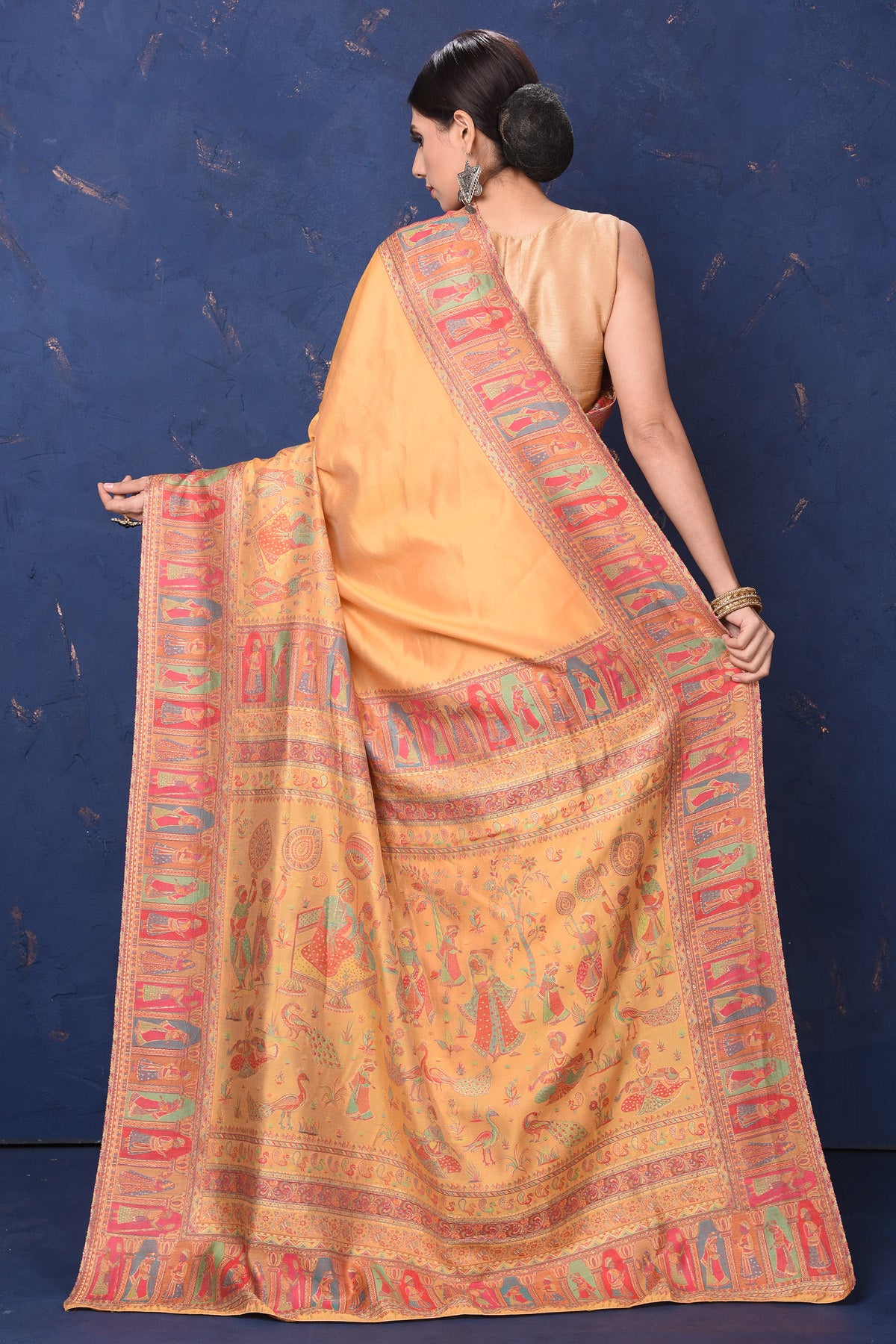 Shop stunning yellow Kani weave tussar muga silk saree online in USA. Buy latest designer sarees, handloom saris, embroidered sarees, Bollywood sarees, fancy sarees for special occasions from Pure Elegance Indian fashion store in USA. Shop soft silk sarees, pure Banarasi sarees, cotton sarees, georgette sarees. -back