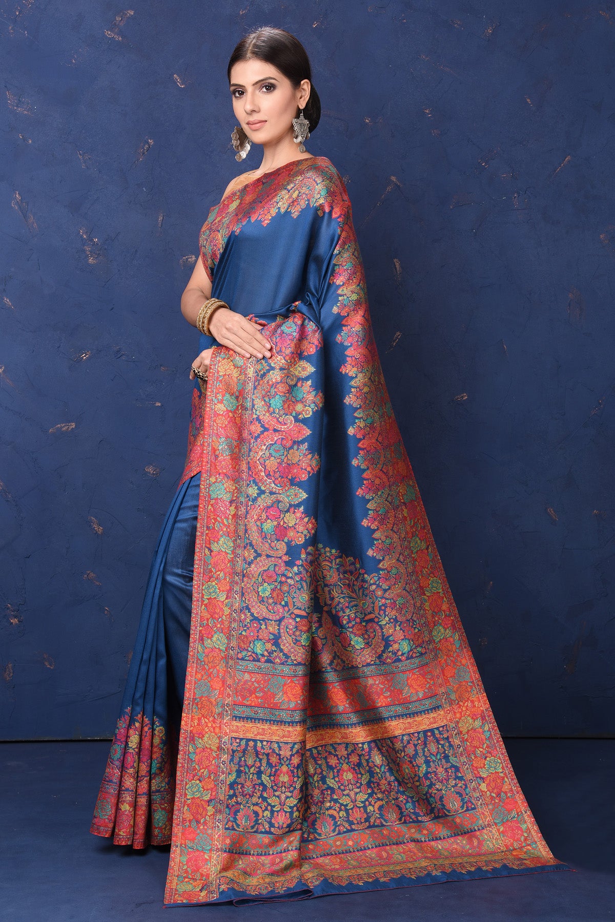 Shop stunning blue Kani tussar muga silk saree online in USA with Kani border. Buy latest designer sarees, handloom saris, embroidered sarees, Bollywood sarees, fancy sarees for special occasions from Pure Elegance Indian fashion store in USA. Shop soft silk sarees, pure Banarasi sarees, cotton sarees, georgette sarees. -pallu