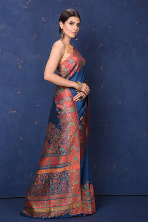 Shop stunning blue Kani tussar muga silk saree online in USA with Kani border. Buy latest designer sarees, handloom saris, embroidered sarees, Bollywood sarees, fancy sarees for special occasions from Pure Elegance Indian fashion store in USA. Shop soft silk sarees, pure Banarasi sarees, cotton sarees, georgette sarees. -right