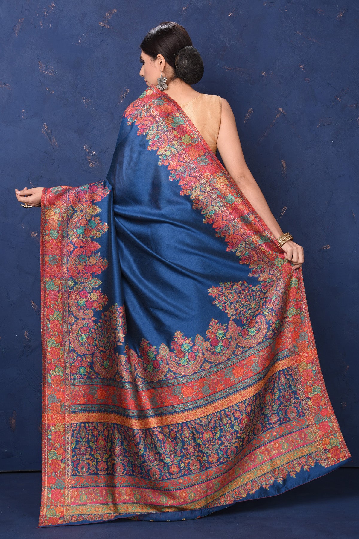 Shop stunning blue Kani tussar muga silk saree online in USA with Kani border. Buy latest designer sarees, handloom saris, embroidered sarees, Bollywood sarees, fancy sarees for special occasions from Pure Elegance Indian fashion store in USA. Shop soft silk sarees, pure Banarasi sarees, cotton sarees, georgette sarees. -back