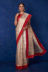 Shop stunning beige foil print organza sari online in USA with red border. Keep your ethnic wardrobe with exclusive designer sarees, handloom sarees, pure silk sarees, soft silk sarees, Banarasi silk sarees from Pure Elegance Indian fashion store in USA.-full view