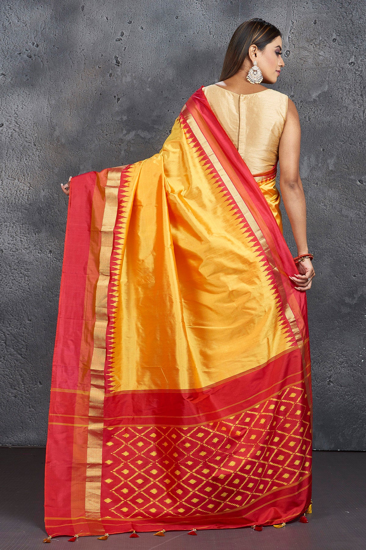 Shop beautiful yellow pure silk saree online in USA with ikkat pallu. Keep your ethnic wardrobe up to date with latest designer sarees, pure silk sarees, Kanchipuram silk sarees, handwoven sarees, tussar silk sarees, embroidered sarees from Pure Elegance Indian saree store in USA.-back