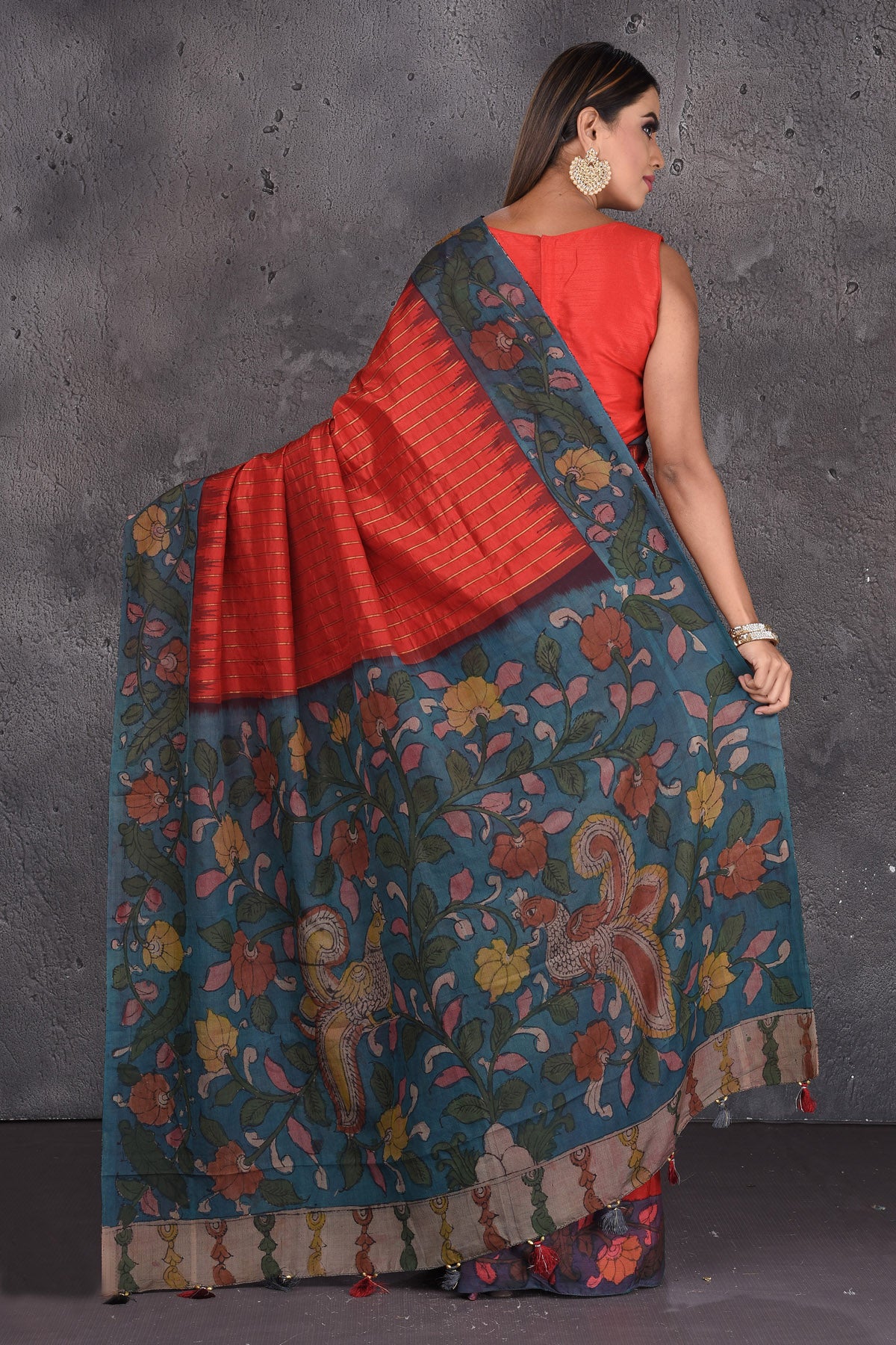 Shop stunning red silk sari online in USA with Kalamkari print pallu. Keep your ethnic wardrobe up to date with latest designer sarees, pure silk sarees, handwoven sarees, tussar silk sarees, embroidered sarees, printed sarees from Pure Elegance Indian saree store in USA.-back