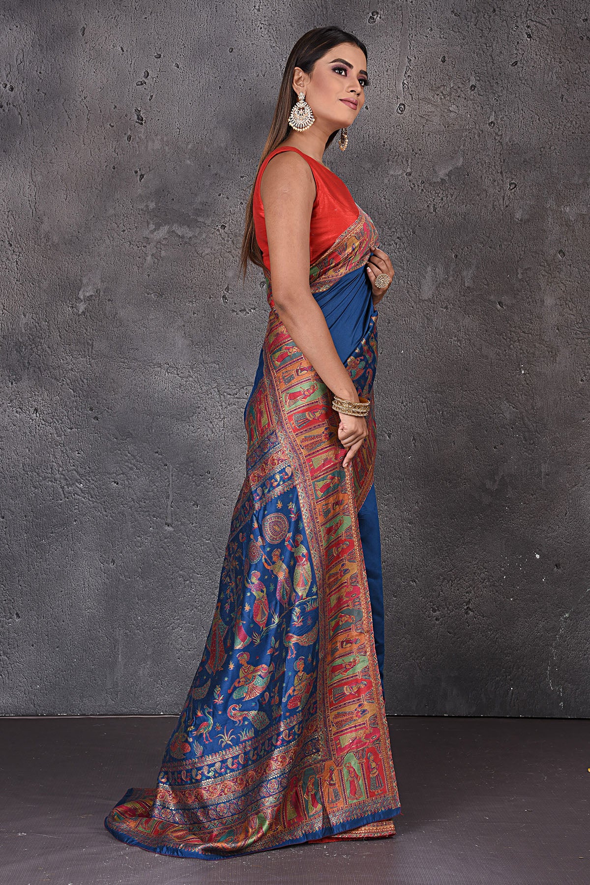 Shop stunning blue Kani weave tussar silk sari online in USA. Keep your ethnic wardrobe up to date with latest designer sarees, pure silk sarees, handwoven sarees, tussar silk sarees, embroidered sarees from Pure Elegance Indian saree store in USA.-side